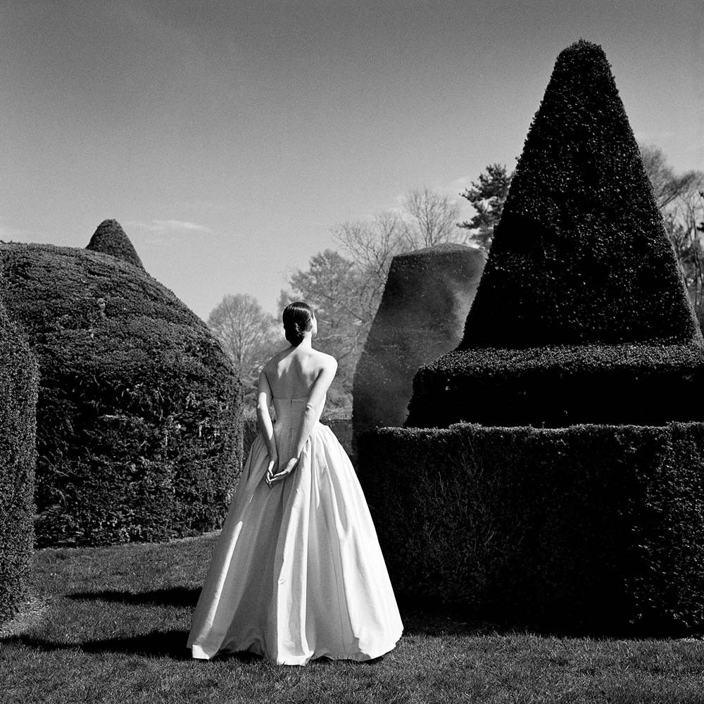 Bernadette in White Dress from behind, Longwood Gardens, Pennsylvania, 1997© Rodney Smith